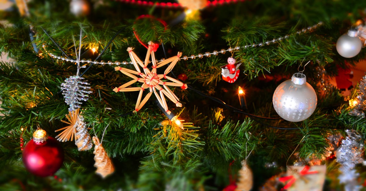 Close-up of a decorated Christmas tree with lights and ornaments, showcasing holiday spirit.